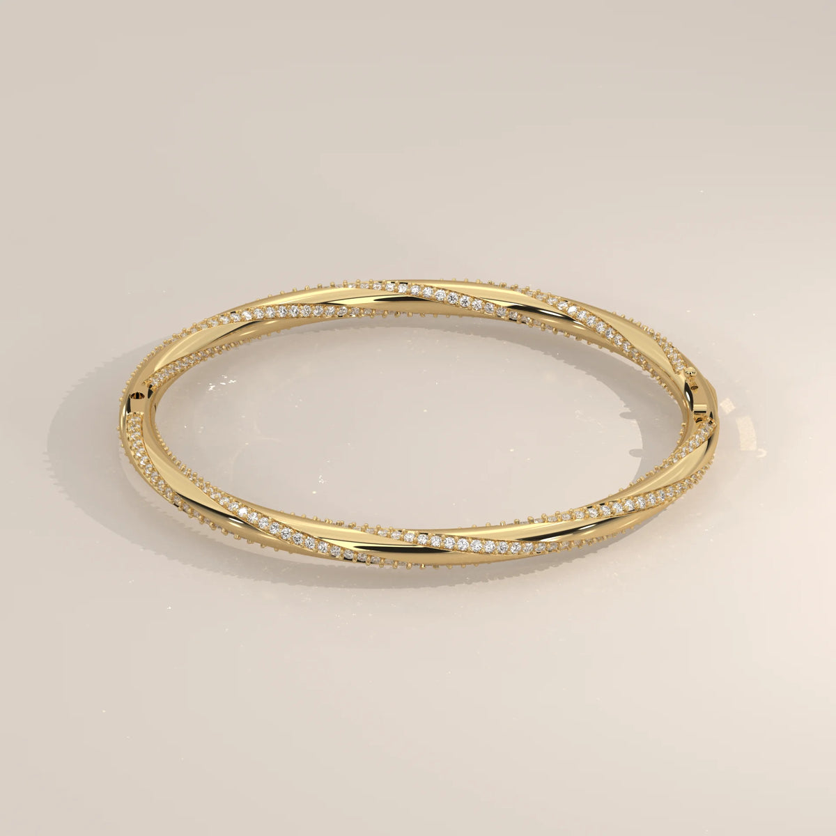Twisted Pave Lab Grown Diamond Hinged Bangle with Polished Band in yellow gold, shown at an angle.