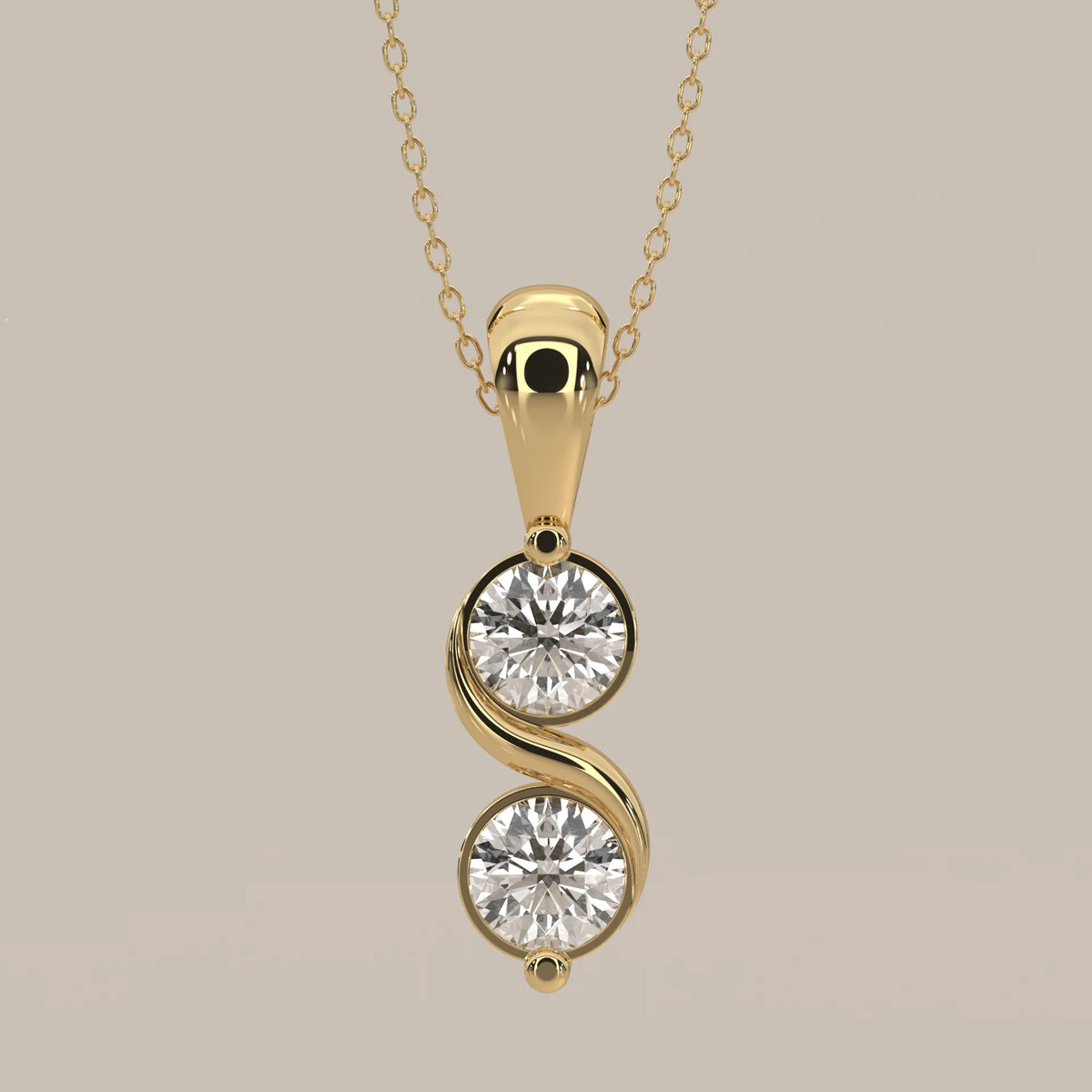 Two Stone Bezel Round Lab Grown Diamond Pendant with S Curve in yellow gold, shown on a plain background.