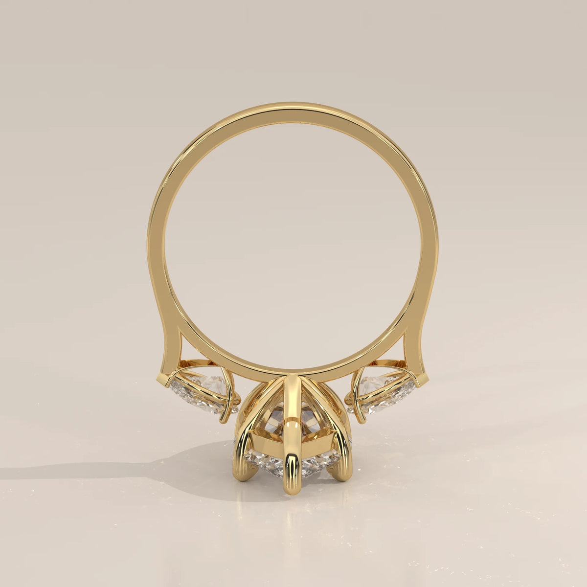 Umor 5 Carat Marquise Lab Grown Diamond Three Stone Ring, Pear Sides in yellow gold, shown on a plain background.