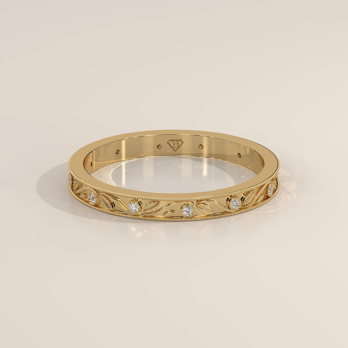 Vintage Engraved Band with Bezel Set Diamond Stations in yellow gold, shown from the front.