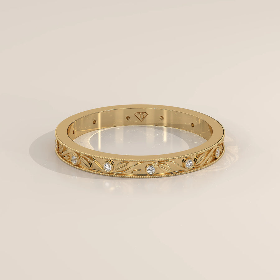 Vintage Engraved Band with Bezel Set Diamond Stations in yellow gold, shown from the front.